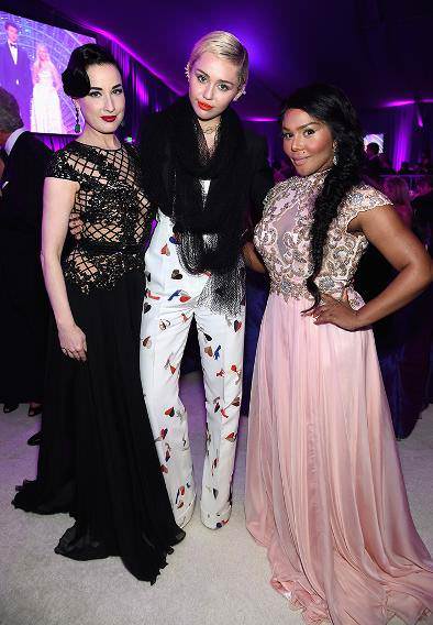 Lil Kim with Miley Cyrus and Dita Von Teese at the 23rd Annual Elton John AIDS Foundation's Oscar Viewing Party